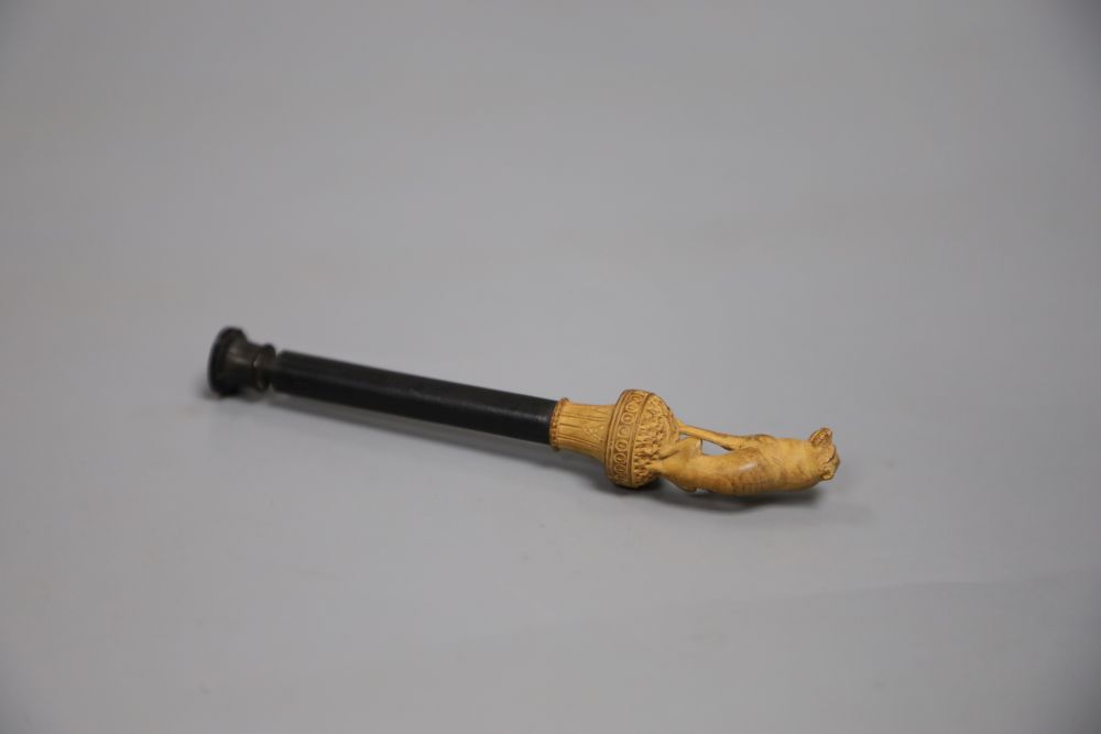 A pipe pamper with dog finial